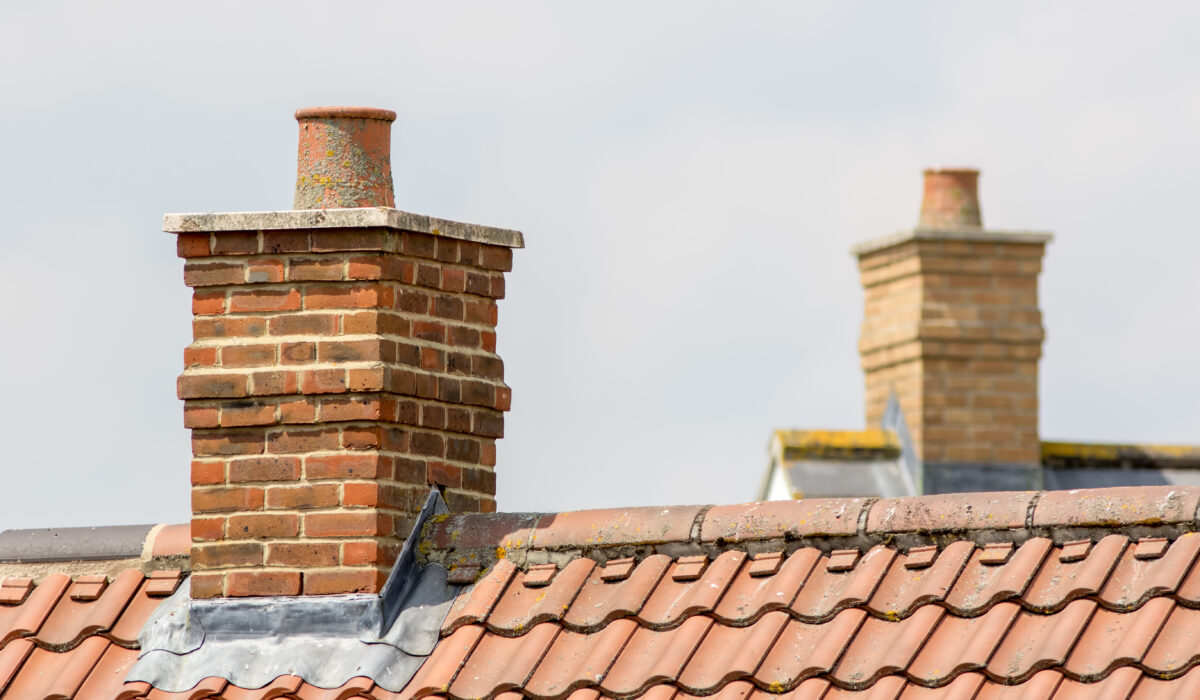 Brick,Chimney,Stack,On,Modern,Contemporary,House,Roof,Top.,Urban