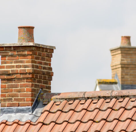 Brick,Chimney,Stack,On,Modern,Contemporary,House,Roof,Top.,Urban